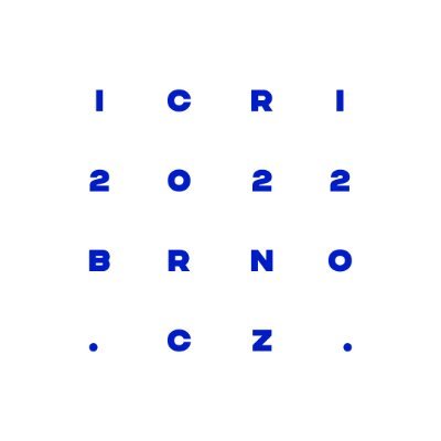  A white circle with “ICRI 2022 BRNO .CZ.” in rich blue block letters. Each four-character sequence is on its own line, creating the illusion of a square.
